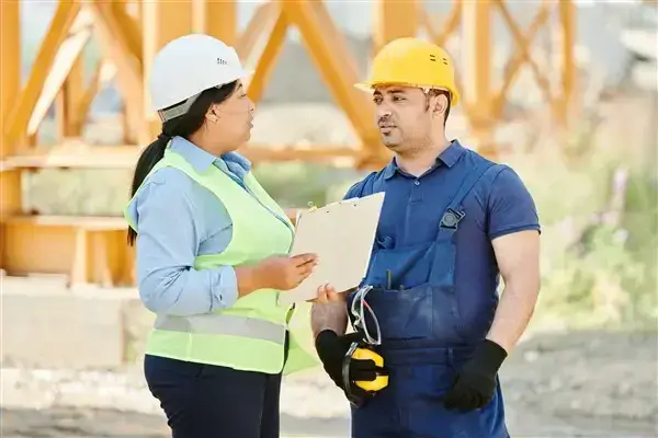 A site inspector with a worker on site