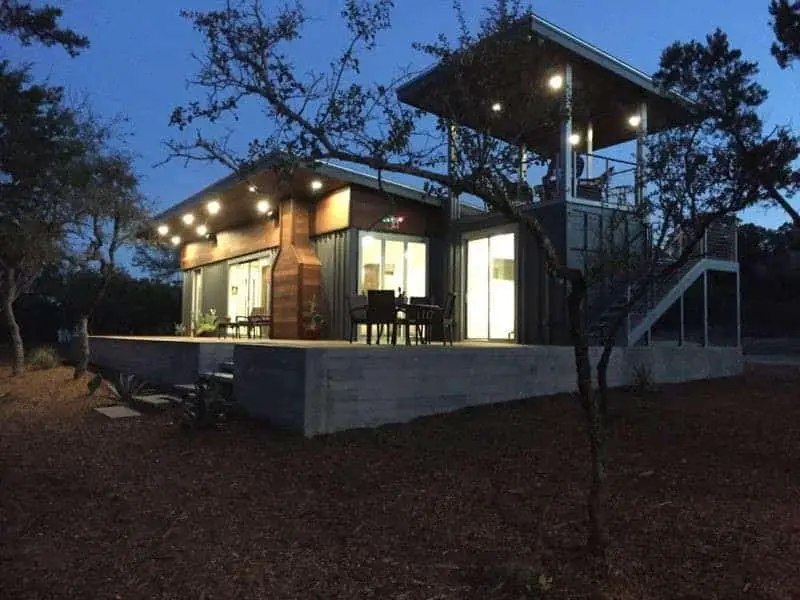 luxury shipping container home at night