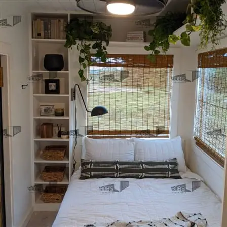 Container home bedroom with blinds in the windows