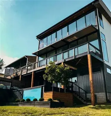 shipping container home with a pool and a deck