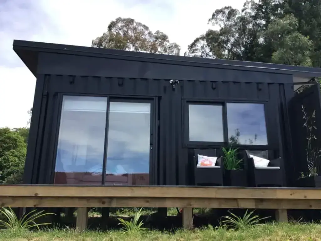 A beautiful black affordable container home