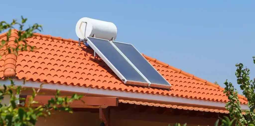 Solar water heater mounted on top of a roof