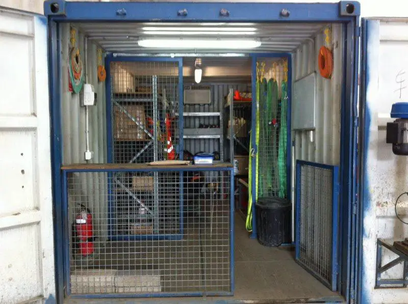 A sea container converted to a single container workshop.