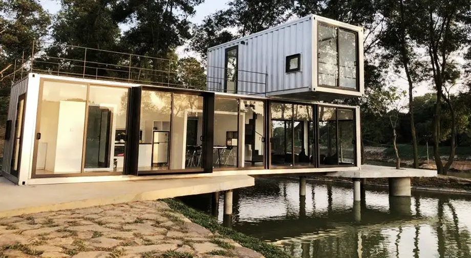A container home situated next to the water