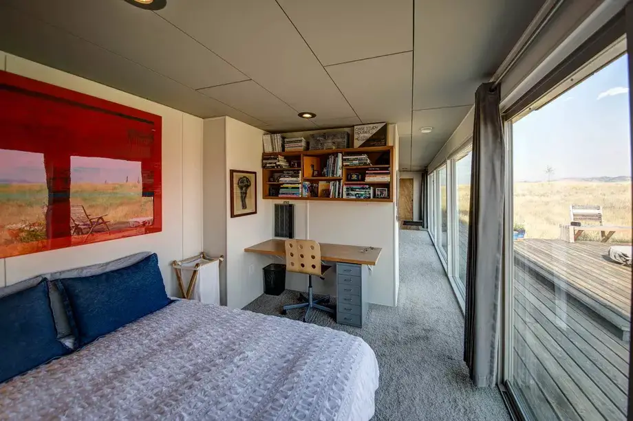 A shipping container home with a bedroom
