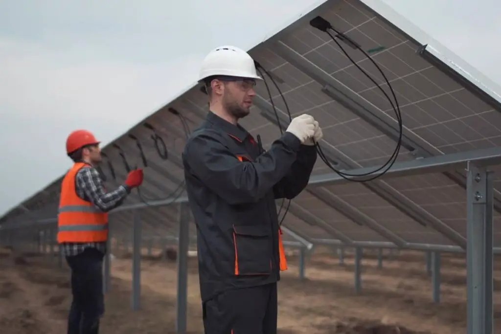 Two men working on solar PV systems