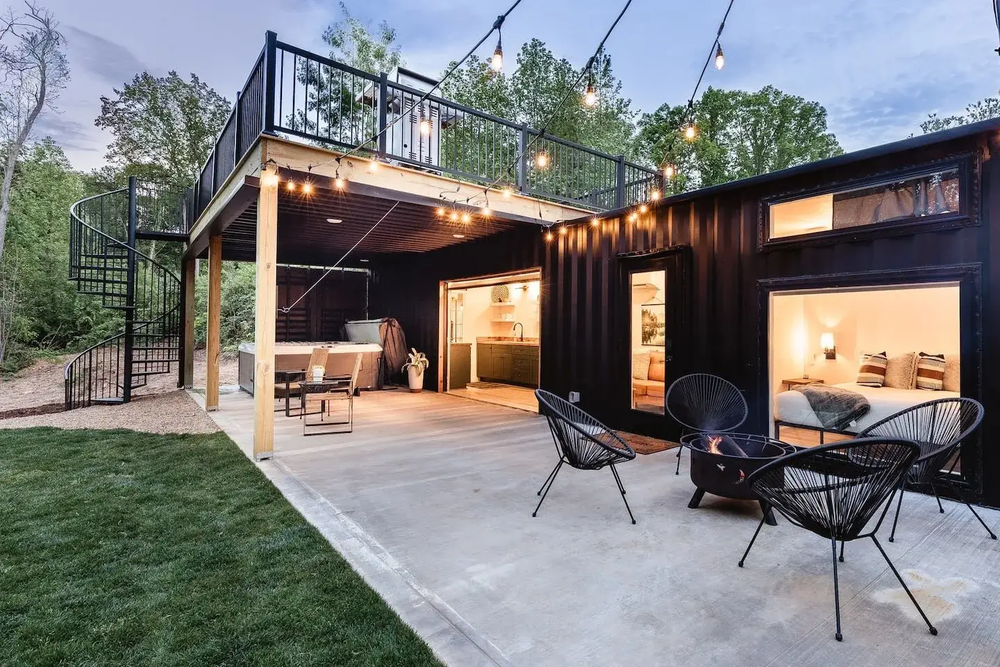 A well decorated container home with hanging aesthetic lights