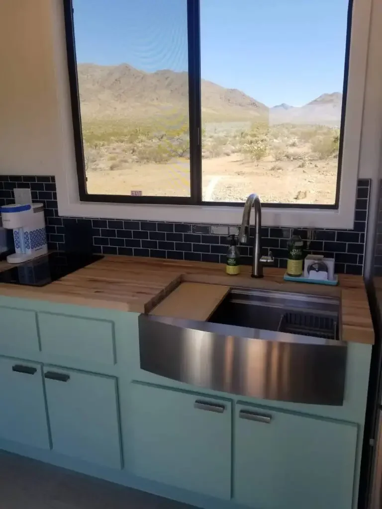 Kitchen area of 40 foot shipping container home in White hills, Arizona, United States