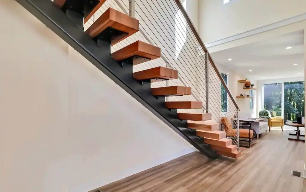 Staircase and living area of a shipping container home in Ball Ground, Georgia, United States