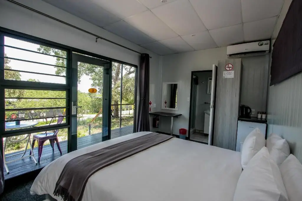 Bedroom of luxurious container hotel SleepOver Kruger Gate