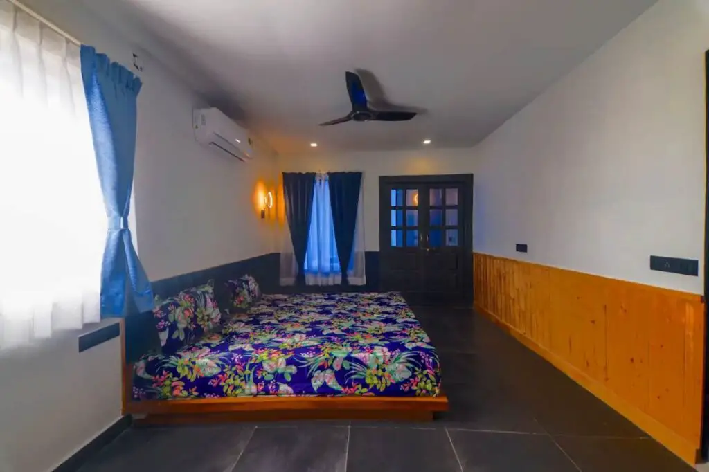 Bedroom in a shipping container home in Bukkasagara, India