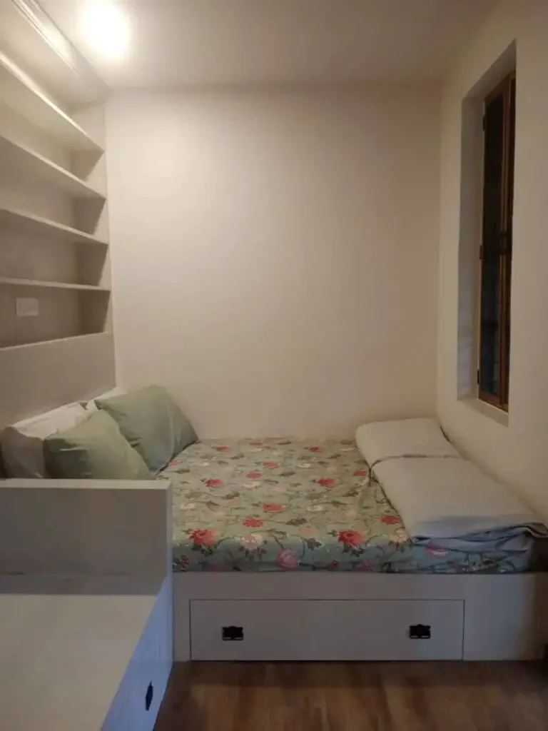 Double bed in a two-person shipping container home in Chennai, India