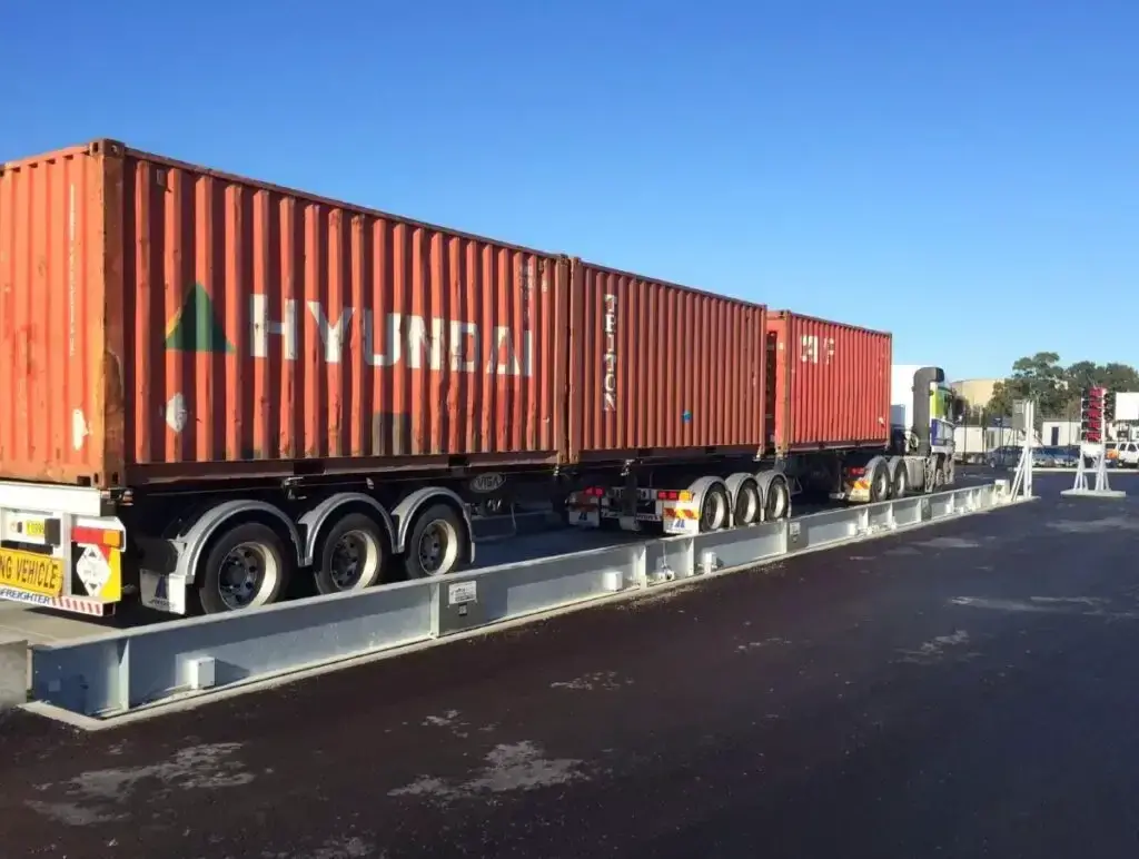 truck with shipping containers on a weighbridge