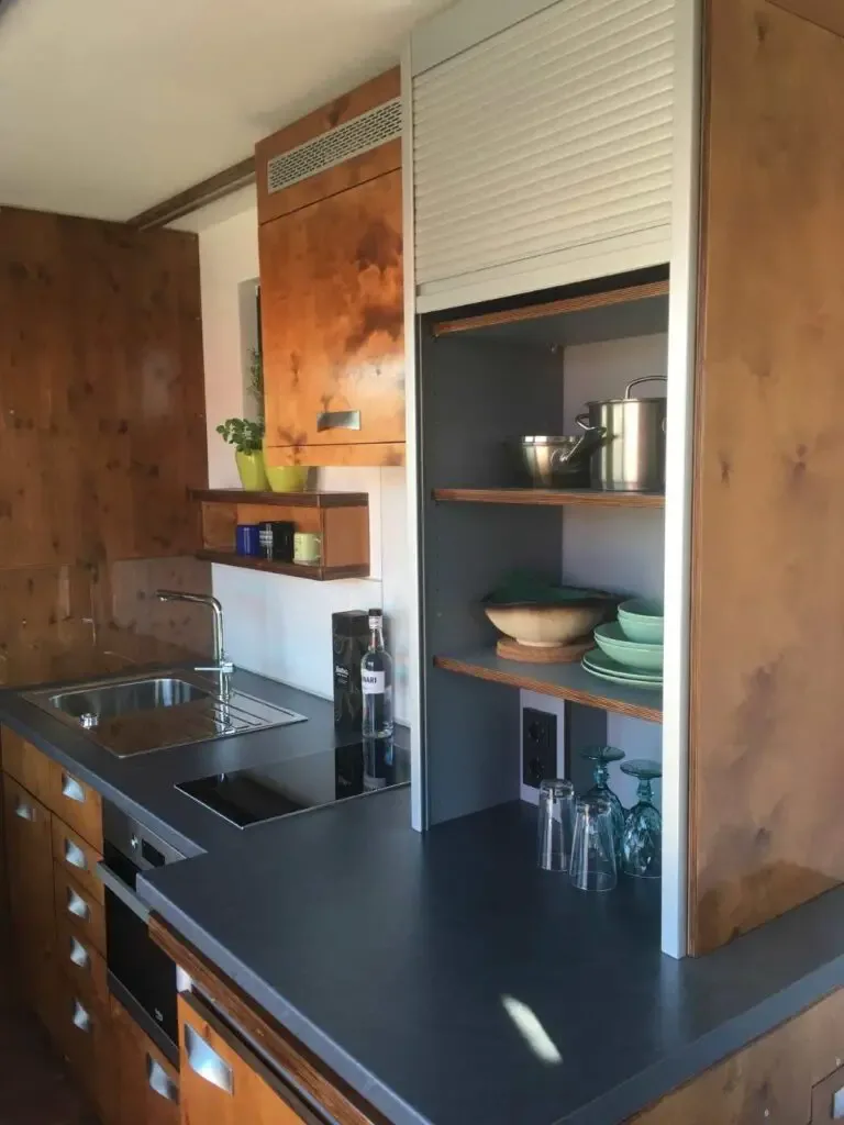 Kitchen area of shipping container home in Coburg, Germany