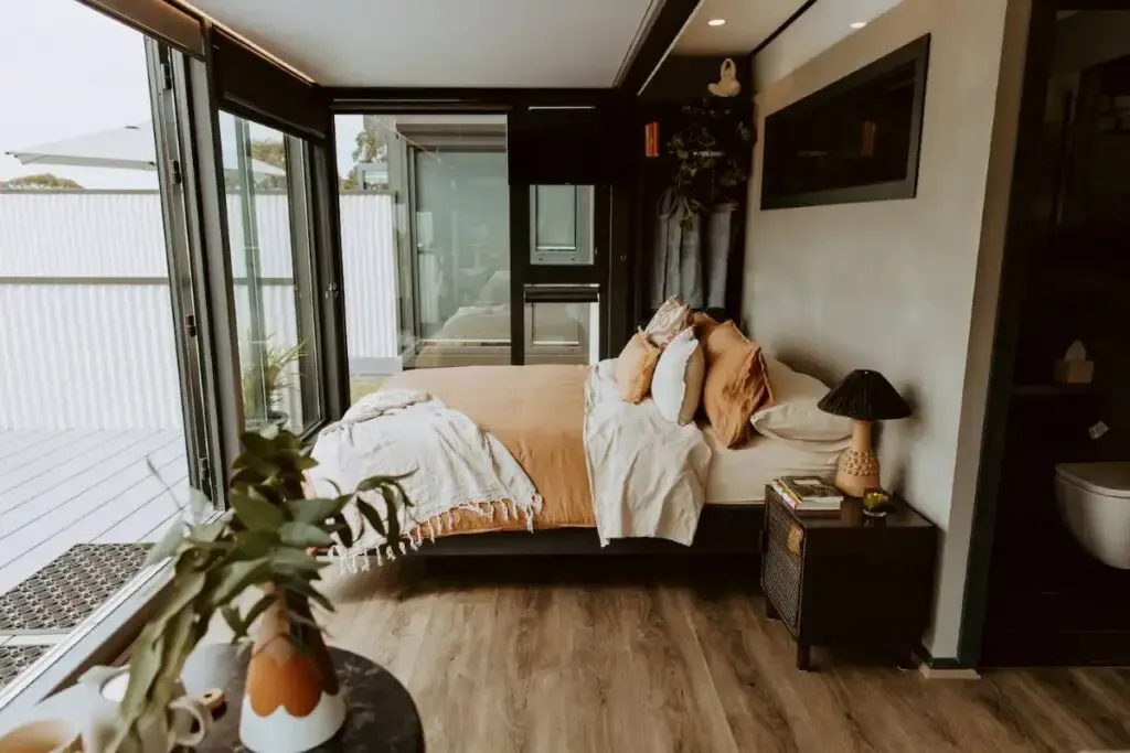 A bed in a shipping container home in Lorne, New South Wales, NSW, Australia